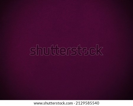 Purple magenta velvet fabric texture used as background. Empty purple fabric background of soft and smooth textile material. There is space for text..	