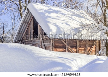 Abandoned cottage in the mountain covered with snow