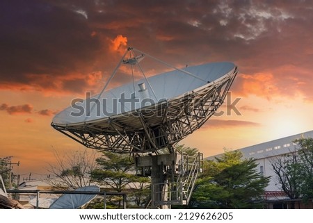 satellite dish radar antenna station in field. parabolic antennas. Big parabolic antenna against sky. Satellite dish at earth station with a sky. Royalty-Free Stock Photo #2129626205