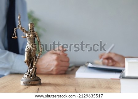 a female lawyer at a meeting with a male client in the office of the law office, legal advice online. resolution of disputes of the family code during divorce and division of property.