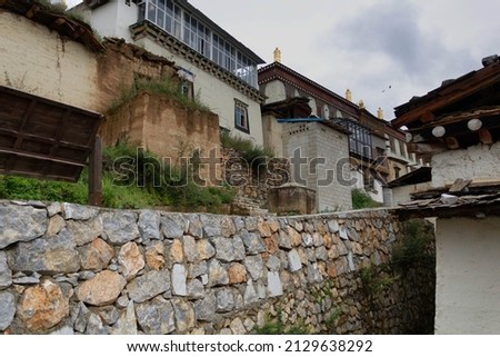 ancient wall and buildings in Ganden Sumtseling Gompa near Shangri-La, Yunnan, China