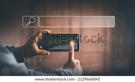 Businessman using smartphones to search stock trading information from social media, stock market, Data search technology, Search Engine Optimization, Using Search Console for ​your website, SEO. 
