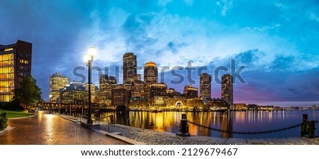 Panorama of Boston cityscape at Fan Pier Park at night, USA