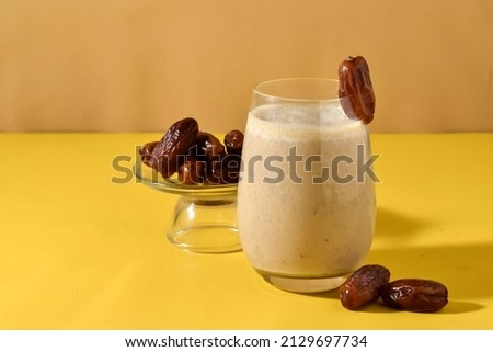Susu Kurma or Smoothie Dates made from milk and dates or palm fruits. Popular as a Suhoor menu during Ramadan, important to give us energy while fasting. Isolated, copy space for  Royalty-Free Stock Photo #2129697734