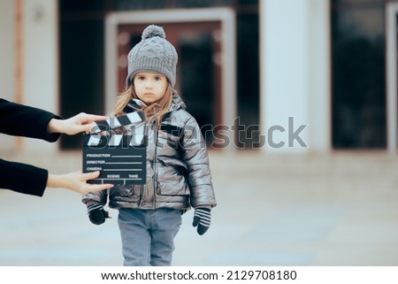 
Actor Child Looking at the Camera Filming a Commercial. Little kid taking acting classes displaying natural talent and skill in front of the camera
 Royalty-Free Stock Photo #2129708180