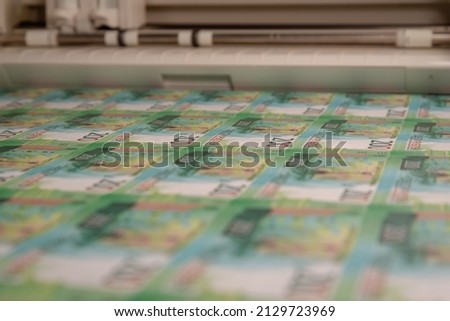 Banknotes, printing and cutting sheets.
