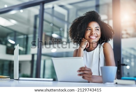 Thinking about how to take the business to technological heights. Cropped shot of an attractive young businesswoman working in her office. Royalty-Free Stock Photo #2129743415