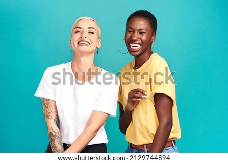 Life is beautiful with your bestie by your side. Studio shot of two happy young women posing together against a turquoise background. Royalty-Free Stock Photo #2129744894