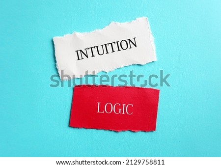 White and red ripped paper with text LOGIC and INTUITION , concept of choosing using logic to make decision or follow instinct - trusting feelings of intuition which valuable in some circumstances Royalty-Free Stock Photo #2129758811