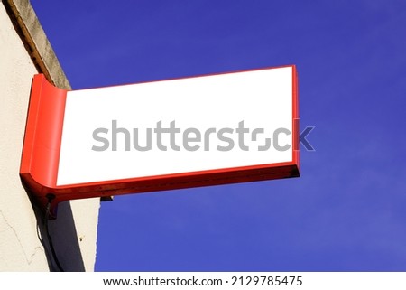 Blank mockup square store signboard empty shop lightbox red on facade wall