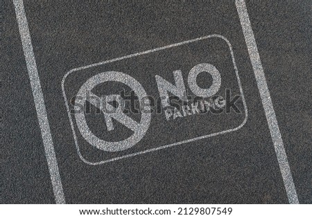 No parking sign on asphalt, traffic signs