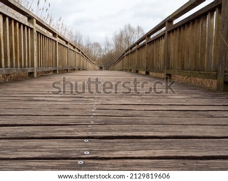 Wooden bridge over the river.