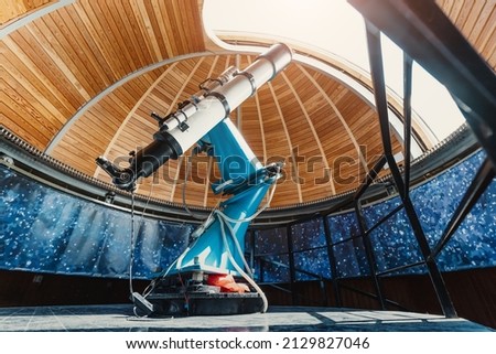 A professional telescope in a space observatory with automatic bearing and platform rotation mechanisms Royalty-Free Stock Photo #2129827046