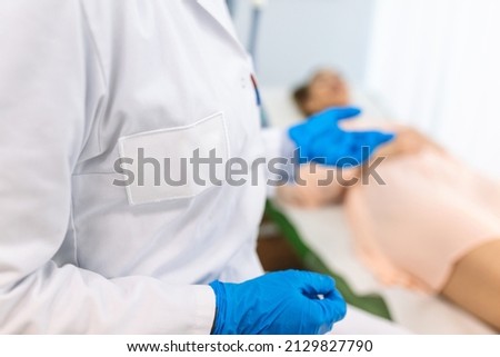 female doctor professional gynecologist examining her patient on a gynecological chair healthcare medicine feminine gynecology concept.