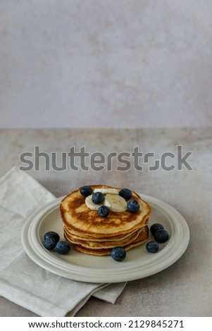 homemade pancakes with banana and blueberry for breakfast