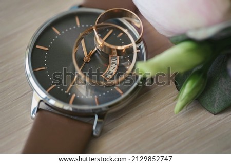 Men's watches and groom's wedding rings. Accessories.