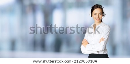 Call center. Portrait of customer support advertiser salescaller operator in headset. Businesswoman or phone worker inside. Answering service centre agent blurred office background. Skype zoom adviser Royalty-Free Stock Photo #2129859104