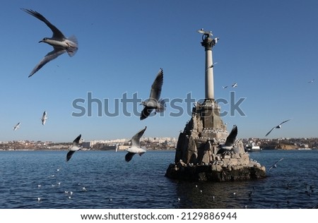 Seagulls near the monument to the sunken ships in the city of Sevastopol (Crimea, Crimean peninsula) Royalty-Free Stock Photo #2129886944