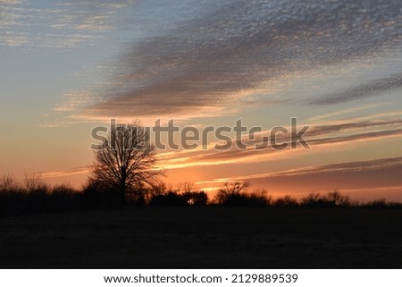 Dramatic sunset over a rural field