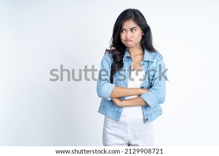 asian woman stand cross hand with unhappy sad face