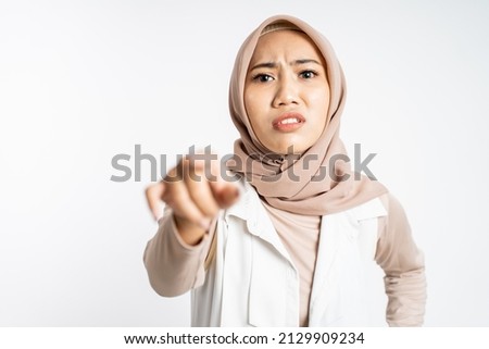 woman with finger pointing make fun on someone