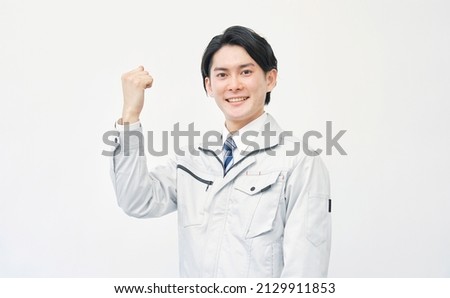 Asian worker guts pose gesture in white background