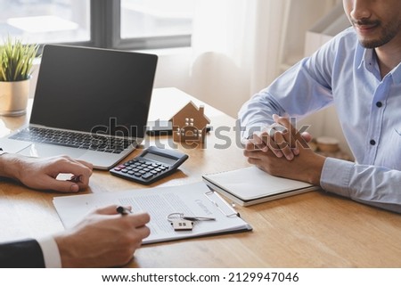Asian tenant, client man sign signature contract rental purchase, buyer home or apartment with landlord, realtor after banker agreement mortgage, loan success or done. Property lease agent concept. Royalty-Free Stock Photo #2129947046