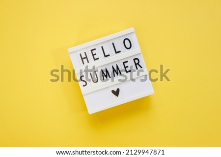Lightbox with text Hello Summer. Summer vacation concept. Top view. Copy space.