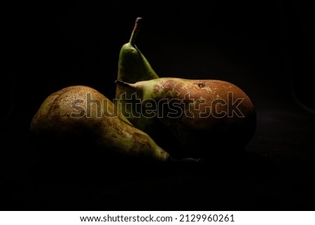 Three pears in the darkness