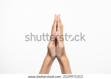 Make a wish. Hands intertwined on a white background.