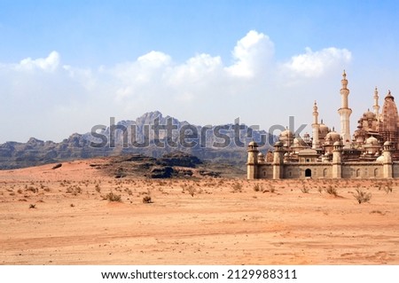 A fabulous lost city in the desert. Fantastic oriental town in the sands. Fantasy landscape with rocky mountains and fairytale city Royalty-Free Stock Photo #2129988311