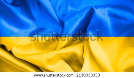flag ukraine silk background, texture Royalty-Free Stock Photo #2130033350