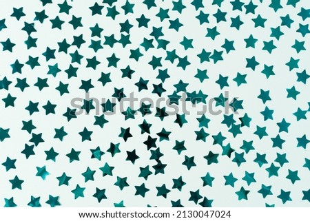 Seamless pattern with blue stars on a blue background. Horizontal photo. Wallpaper, texture, background for your design and copy space.