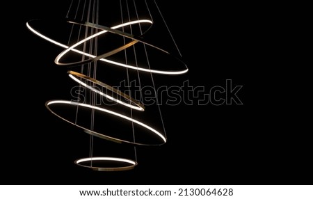 LED chandelier from several circles interconnected. Royalty-Free Stock Photo #2130064628