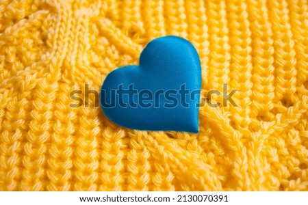 blue heart on yellow background