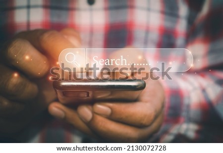 Hand man using moblie phone for Searching browsing data on the Internet online.network,media, keyword,Digital Web,Photo concept Searching information of and Technology.