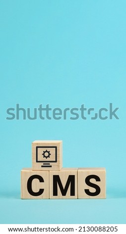 CMS acronym on woodblock cubes blue background, Frequently asked