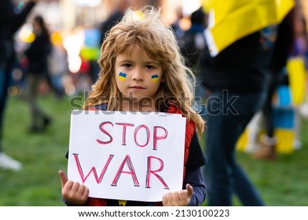 Board No war, Stop war. Little ukrainian patriot. No war with Ukraine. Ukrainian geopolitics globe crisis. Royalty-Free Stock Photo #2130100223
