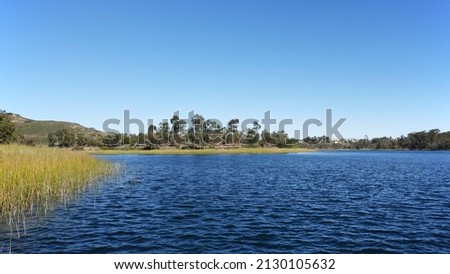 A View of Lake Miramar and walking trail at Miramar reservoir in San Diego, California.