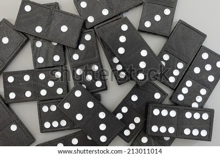A close up shot of black and white dominos