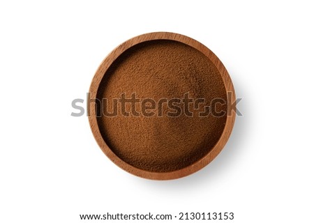 Instant coffee granules in wooden bowl isolated on white background. Top view Royalty-Free Stock Photo #2130113153