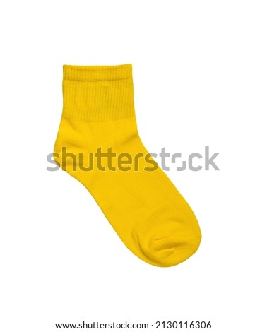 Sporty women's yellow sock isolated on a white background. A stylish sports accessory. Flat lay. Royalty-Free Stock Photo #2130116306