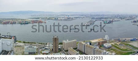 Overcast aerial view of Osaka port cityscape from Cosmo Tower Observatory at Japan