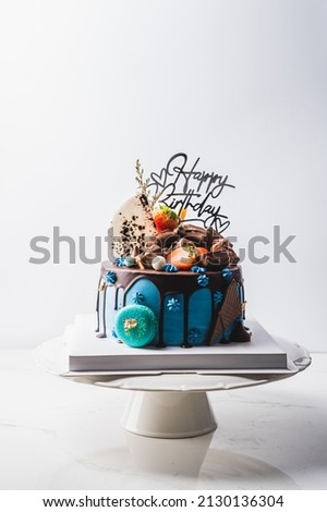 birthday cake with flower,macarons ans chocolate food anniversary concept cover banner background.	
