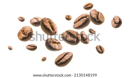 Coffee beans levitate on a white background Royalty-Free Stock Photo #2130148199