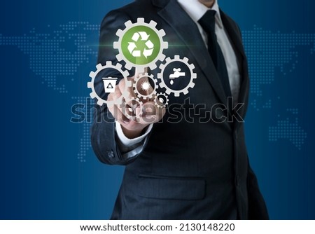 Business man on suit choose to recycle icon to save nature environment. Male hand click green recycle symbol technology ecology concept.