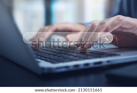 Data Search Technology Search Engine Optimization (SEO). Woman's hands  typing on laptop computer keyboard to search the information, online content. Royalty-Free Stock Photo #2130151661