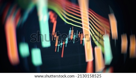 Charts of financial instruments with various type of indicators including volume analysis for professional technical analysis on the monitor of a computer.
