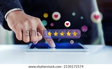 Customer Experiences Concept. Closeup of  Businessman Using Digital Tablet to Giving Feedback via the Internet. Positive Review. Client Satisfaction Surveys. Front View Royalty-Free Stock Photo #2130172574