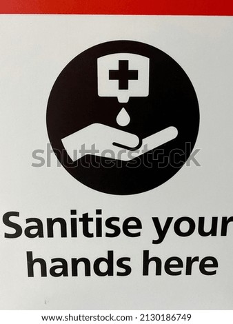 Hand sanitizer sign at a sanitizer point